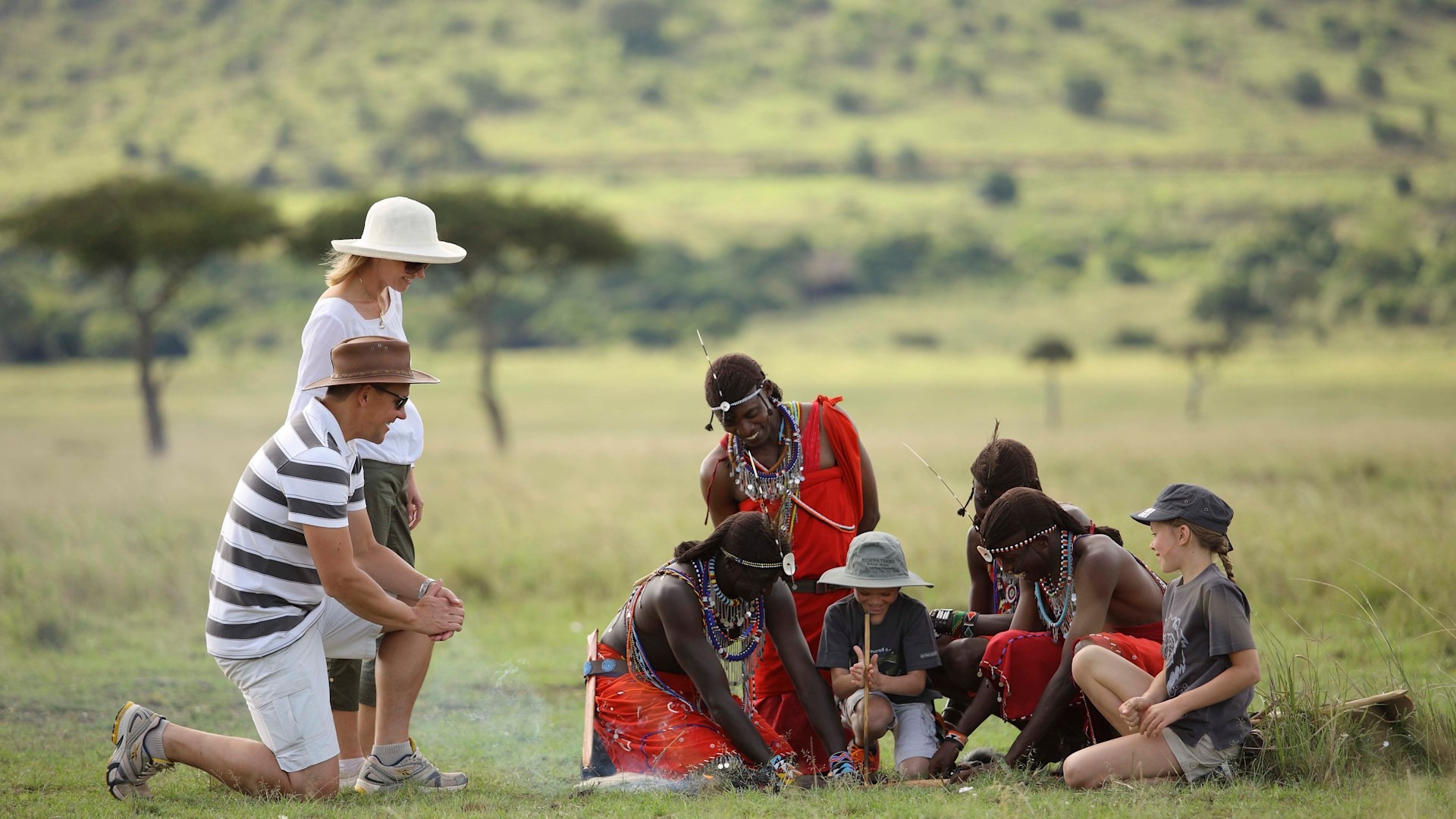 imgi_181_Kenya-Kichwa-WILDchild-Maasai-teaching-family-to-make-a-fire-Website-1920x1080-fill-gravityauto
